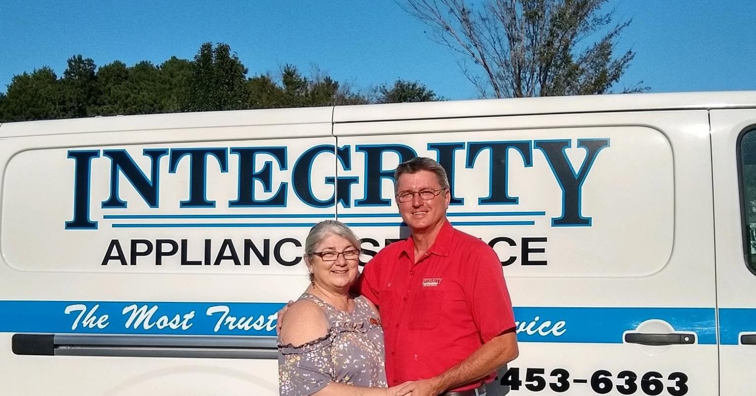 Integrity Appliance Service owners in front of their service van